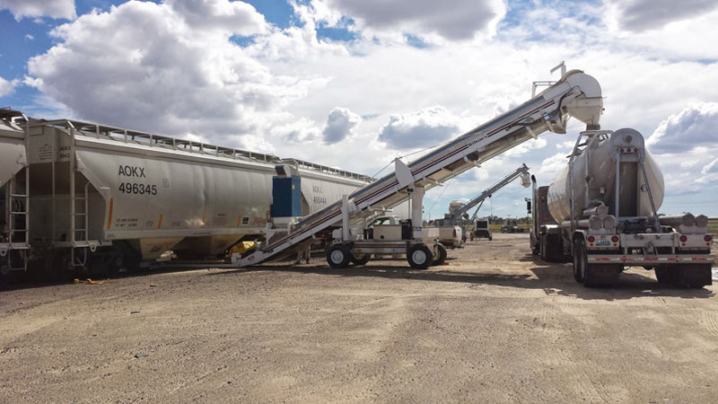 ADAM TRUCKING BULK PNEUMATIC TRANSPORTATION. LOADING FROM RAIL TO TRUCK